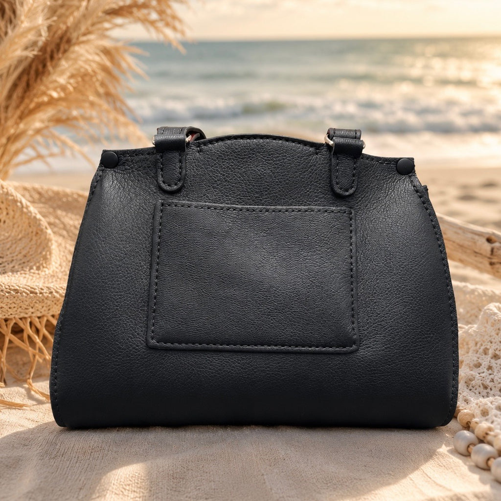 Back view of black handbag with exterior slip pocket
