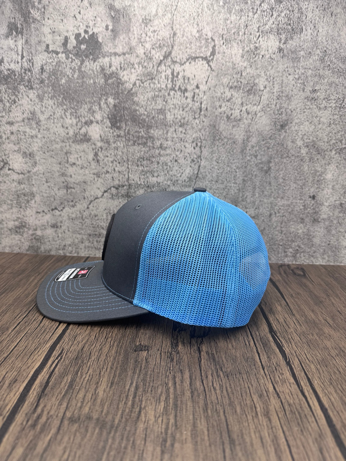 Side view showing bright blue mesh back of the Hammerhead Shark leather patch hat